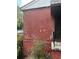 Home exterior showing weathered red siding and trim with some foundation block detail at 2625 Baker Nw Rd, Atlanta, GA 30318