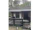 View of front porch showing brick building with awning covered window and security door at 2625 Baker Nw Rd, Atlanta, GA 30318