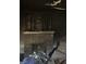 This is a view of the living room showing fire damage to the fireplace and walls at 2625 Baker Nw Rd, Atlanta, GA 30318