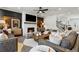 Cozy living room featuring a fireplace, stylish furnishings, elegant decor, and abundant natural light at 5350 Hyde Rd, Cumming, GA 30040
