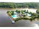 Aerial view highlighting a stunning lakeside community with a resort-style pool and tennis courts at 7435 Woodruff Way, Stone Mountain, GA 30087