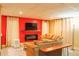 Finished basement with a cozy seating area featuring a fireplace and large screen TV at 7435 Woodruff Way, Stone Mountain, GA 30087