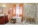 Bright bathroom with a standalone tub, glass shower, and modern fixtures at 7435 Woodruff Way, Stone Mountain, GA 30087