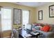 Bedroom with a large desk, comfortable seating, and great natural light at 7435 Woodruff Way, Stone Mountain, GA 30087