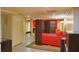 A modern bedroom featuring a privacy screen and partial view of the living room in a studio-style apartment at 7435 Woodruff Way, Stone Mountain, GA 30087