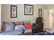 Bedroom with comfortable seating, vibrant artwork, and a bright, airy feel at 7435 Woodruff Way, Stone Mountain, GA 30087