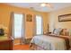 Bedroom with hardwood floors, natural light, and neutral tones at 7435 Woodruff Way, Stone Mountain, GA 30087