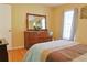 Bedroom with hardwood floors, natural light, and classic furniture at 7435 Woodruff Way, Stone Mountain, GA 30087