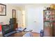 Bedroom featuring a large desk, bookshelves, and a view to the rest of the house at 7435 Woodruff Way, Stone Mountain, GA 30087