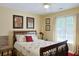 Bedroom featuring a comfortable bed, neutral colors, and natural light at 7435 Woodruff Way, Stone Mountain, GA 30087