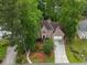 Charming two-story brick home featuring a two-car garage and lush, mature landscaping in a desirable neighborhood at 7435 Woodruff Way, Stone Mountain, GA 30087
