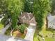 Beautiful brick home with a well-manicured lawn and an attached two-car garage amid lush green trees at 7435 Woodruff Way, Stone Mountain, GA 30087