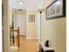 Hallway with hardwood floors and unique artwork at 7435 Woodruff Way, Stone Mountain, GA 30087