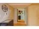 Inviting hallway with neutral paint, modern decor, and easy access to storage and additional rooms at 7435 Woodruff Way, Stone Mountain, GA 30087