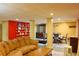 A spacious living area featuring a dining table, shelves, and entertainment console at 7435 Woodruff Way, Stone Mountain, GA 30087