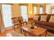 Comfortable living room area featuring lots of natural light, hardwood floors, and neutral decor at 7435 Woodruff Way, Stone Mountain, GA 30087