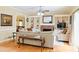 Bright living room with a cozy fireplace, built-in shelving and neutral-toned furnishings at 7435 Woodruff Way, Stone Mountain, GA 30087