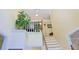 Bright entryway featuring staircase with wood railing, white risers, and neutral decor at 7435 Woodruff Way, Stone Mountain, GA 30087
