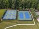 Overhead view of the property's well-maintained tennis courts, perfect for sports enthusiasts and community engagement at 7435 Woodruff Way, Stone Mountain, GA 30087