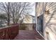 Wooden outdoor deck attached to home with sliding door and outdoor light at 805 Abbotts Mill Ct # 74, Duluth, GA 30097