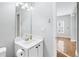 Neutral powder room with a modern vanity and light fixtures at 805 Abbotts Mill Ct # 74, Duluth, GA 30097