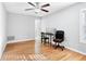 Spacious bedroom with hardwood floors, a ceiling fan, and neutral paint at 805 Abbotts Mill Ct # 74, Duluth, GA 30097