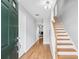Inviting entryway with hardwood floors and a staircase leading to the upper level at 805 Abbotts Mill Ct # 74, Duluth, GA 30097