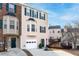 Charming townhome featuring a bay window, green shutters, and a one-car garage at 805 Abbotts Mill Ct # 74, Duluth, GA 30097