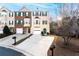 Charming townhome featuring a one car garage, green shutters, and bay windows, creating a welcoming curb appeal at 805 Abbotts Mill Ct # 74, Duluth, GA 30097