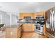 Open kitchen featuring stainless steel appliances and granite countertops at 805 Abbotts Mill Ct # 74, Duluth, GA 30097