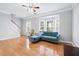 Cozy living room with a bay window and hardwood floors at 805 Abbotts Mill Ct # 74, Duluth, GA 30097