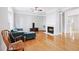 Inviting living room with hardwood floors and a cozy fireplace at 805 Abbotts Mill Ct # 74, Duluth, GA 30097