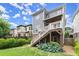 Multi-level back exterior featuring a deck and lush lawn at 1104 Victoria Ne St, Brookhaven, GA 30319