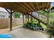Under deck patio area with lush hostas and access to wooden stairs at 1104 Victoria Ne St, Brookhaven, GA 30319