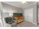 Well-designed Bedroom with modern walls, light wood crib, and plenty of storage, creating a serene environment at 1104 Victoria Ne St, Brookhaven, GA 30319