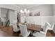 Elegant dining room with modern chandelier, wainscoting, and ample seating for Gathering gatherings at 1104 Victoria Ne St, Brookhaven, GA 30319