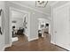 Inviting foyer featuring hardwood floors, arched doorways, and views of the living spaces, creating a warm and welcoming entrance at 1104 Victoria Ne St, Brookhaven, GA 30319