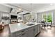 Open-concept kitchen showcasing an expansive island, stainless appliances, and seamless flow to living spaces at 1104 Victoria Ne St, Brookhaven, GA 30319