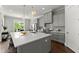 Bright kitchen with a large center island, pendant lights, and modern appliances at 1104 Victoria Ne St, Brookhaven, GA 30319
