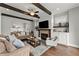 Inviting living room boasts a fireplace, exposed wood beams, and ample seating at 1104 Victoria Ne St, Brookhaven, GA 30319