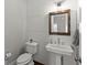 Well-lit powder room featuring a modern sink, shiplap accent wall, and sleek fixtures at 1104 Victoria Ne St, Brookhaven, GA 30319