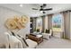 This sitting room features four armchairs, windows and natural lighting at 5360 Hyde Rd, Cumming, GA 30040
