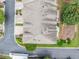 An overhead view of the townhome complex showcases roofing, landscaping, and street access at 6054 China Rose Ln, Duluth, GA 30097