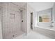 Luxurious bathroom featuring modern tiled walls, a glass-enclosed shower, and a soaking tub for relaxation at 6054 China Rose Ln, Duluth, GA 30097