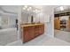 Bathroom with granite countertops, double sinks, and open access to bedroom and closet at 6054 China Rose Ln, Duluth, GA 30097