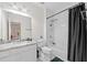 Clean bathroom featuring shower with marble tile, sink, and toilet at 6054 China Rose Ln, Duluth, GA 30097