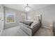 Serene bedroom featuring plush carpeting, abundant natural light, and a stylish chandelier at 6054 China Rose Ln, Duluth, GA 30097