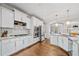 Modern kitchen with white cabinets, subway tile backsplash, stainless steel appliances, and granite countertops at 6054 China Rose Ln, Duluth, GA 30097