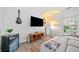 Modern living room area featuring light and bright paint, decor and luxury vinyl flooring at 6054 China Rose Ln, Duluth, GA 30097
