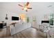 Spacious living area featuring light and bright paint, decor and luxury vinyl flooring at 6054 China Rose Ln, Duluth, GA 30097